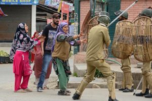 Indians love Kashmir but not the Kashmiris. Indian riot police about to thrash a Kashmiri woman protester in Srinagar