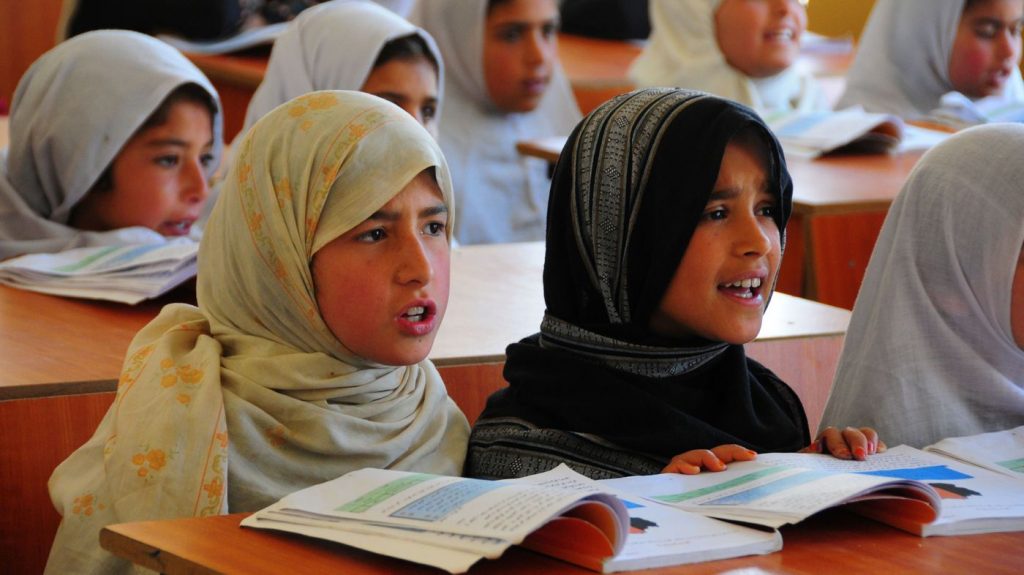 Afghan girls take classes at a refugee school in Afghanistan's Parwan province, on April 3. Under the Taliban, girls were forbidden from receiving an education. Now they account for 40 percent of the country's student enrollment.