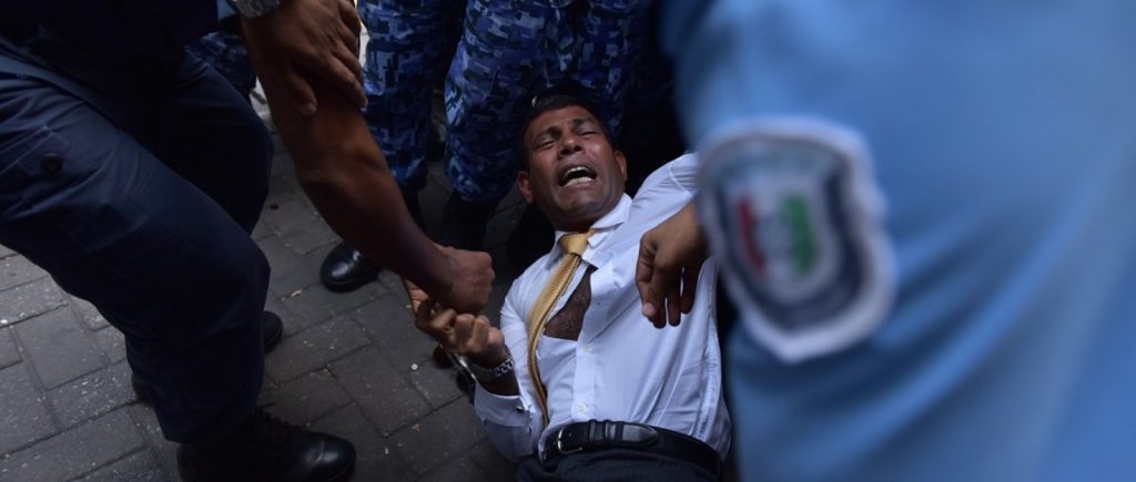 Former President Mohammad Nasheed being forcibly taken away by police