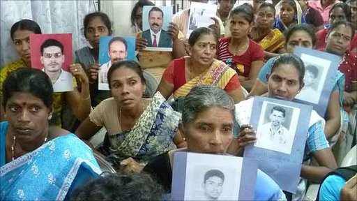 Holding pictures of their sons, husbands or brothers, Sri Lankan Tamil women wait to testify before the Paranagama Commission. 