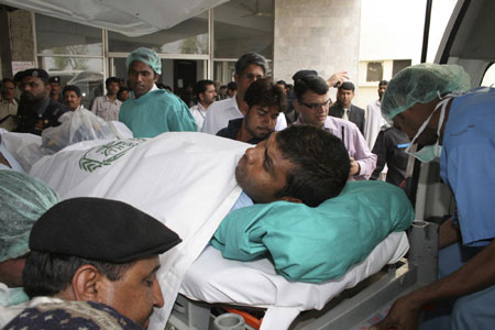 Sri Lankan cricketer Tharanga Paranavitana being taken to Lahore hospital