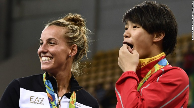 China's gold medalist Shi Tingmao (R) reacts with third-placed Tania Cagnotto of Italy. AFP-Getty Images