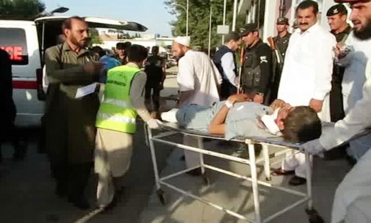 A wounded man being wheeled into a hospital after a suicide attack on a mosque full of worshipers in North West Pakistan bordering Afghanistan 