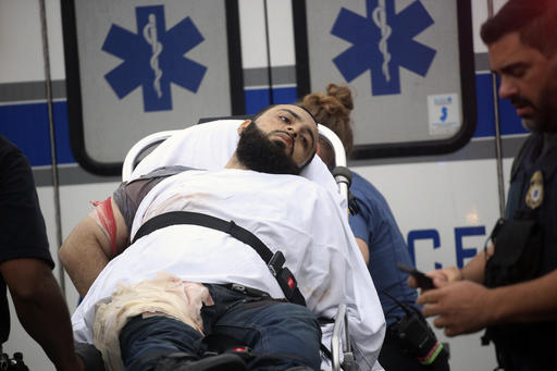 Ahmad Khan Rahami is taken into custody after a shootout with police Monday, Sept. 19, 2016, in Linden, N.J. Rahami was wanted for questioning in the bombings that rocked the Chelsea neighborhood of New York and the New Jersey shore town of Seaside Park. (Nicolaus Czarnecki/Boston Herald via AP) /The Boston Herald via AP)
