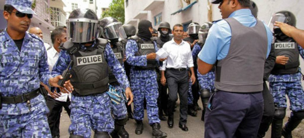 An earlier picture of Nasheed being taken away by the police. Nasheed is currently in Sri Lanka planning to overthrow the Yameen regime legally