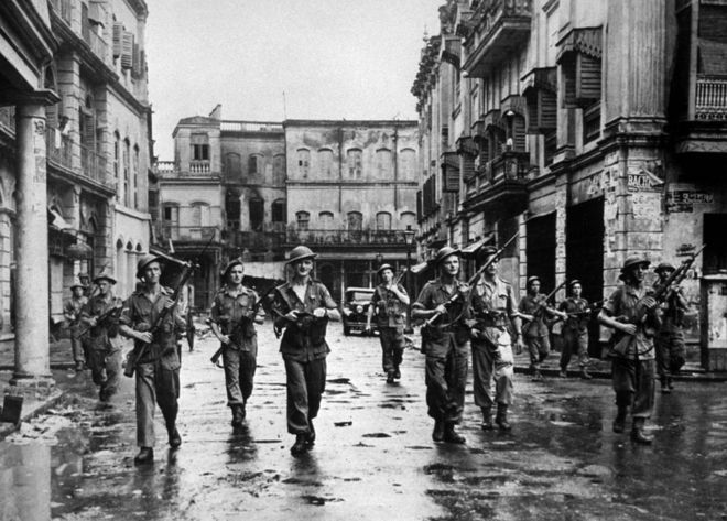 British troops patrolling a riot affected Calcutta street in 1946 