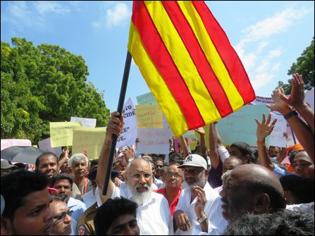 Ezhuga Tamizh rally showing Chief Minister C.V.Wigneswaran holding the red and yellow flag popularized by the LTTE during its Pongu Tamil rallies