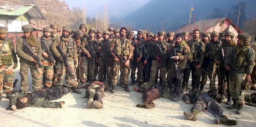 Uri: Army personnel stand near the dead bodies of militants who attacked Mohura army camp, in Uri. 