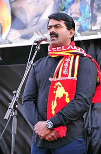 'Naam Tamilar' party leader Sebastian Seeman wearing his trade mark scarf with a map of Tamil Eelam embossed on it.