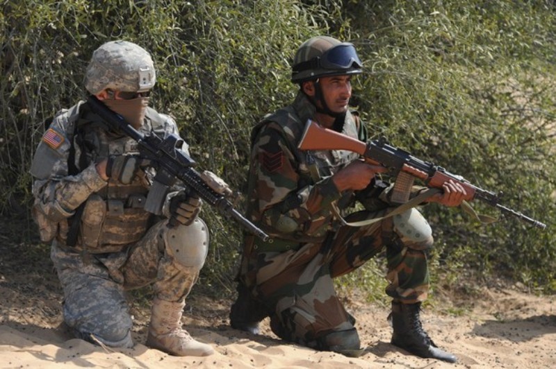 Indian and US soldiers participate in the Yudh Abhyas 2012 military exercise at Mahajan in Rajasthan sector, some 150 kms. from Bikaner, on March 13, 2012. The five-day India-US army exercise was aimed at improving bilateral defence and diplomatic relations between the two countries. AFP PHOTO 