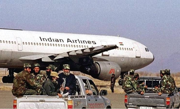Afghan Taliban commandos surround hijacked Indian Airlines aircraft. Masood Azhar was released from Indian jail for releasing hostages