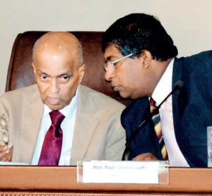Sri Lankan Finance Minister Ravi Karunanayake consulting ministerial adviser R.Paskaralingam