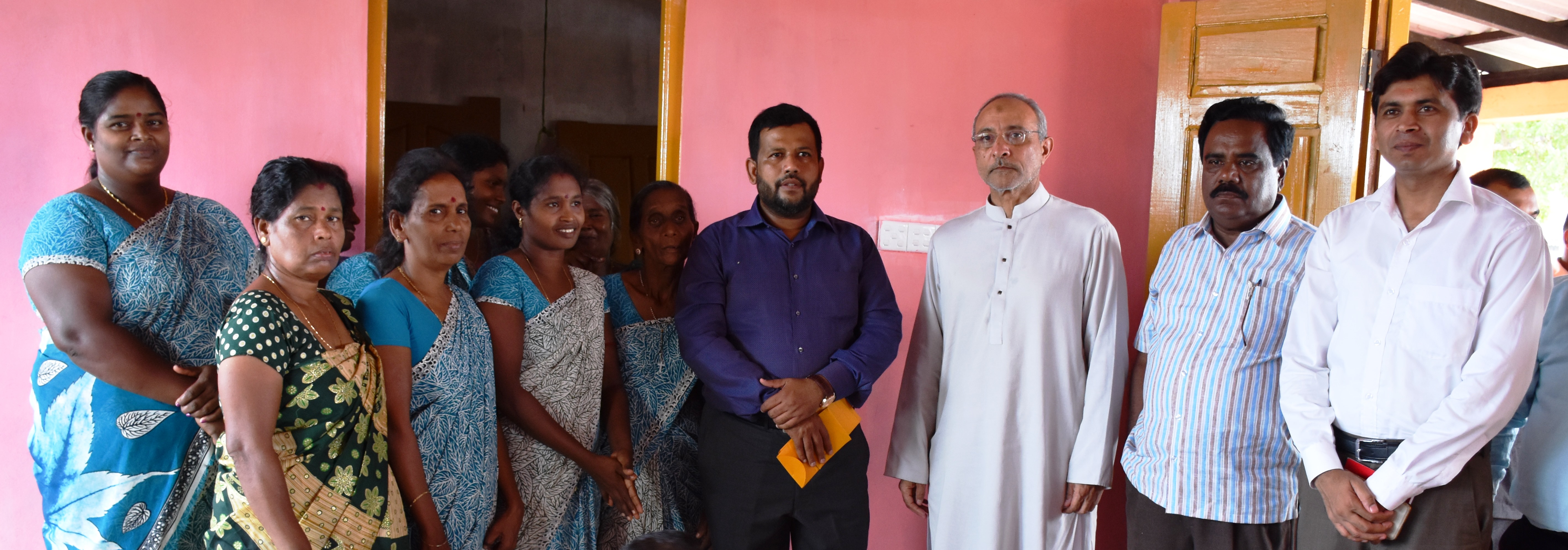 Pakistani envoy  Maj.Gen.Syed Shakeel Hussain with Tamil beneficiaries of the Pakistani housing project.  