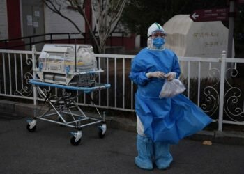 An eruption of new virus cases in South Korea (Photo by AFP)