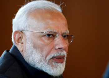 Indian Prime Minister Narendra Modi speaks to Russian President Vladimir Putin during their meeting on the sideline of the 11th edition of the BRICS Summit, in Brasilia, Brazil November 13, 2019. Pavel Golovkin/Pool via REUTERS