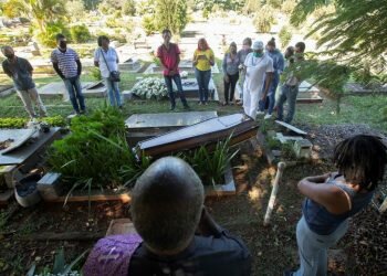 A small number of people accompany the burial of a Covid-19 victim at a cemetery in Brazil, May 26, 2020.PHOTO: EPA-EFE