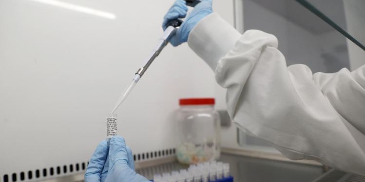 Scientists are seen working at Cobra Biologics, they are working on a potential vaccine for COVID-19, following the outbreak of the coronavirus disease (COVID-19), in Keele, Britain, April 30, 2020. REUTERS/Carl Recine