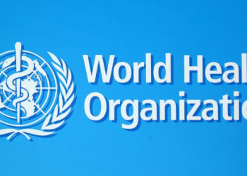 FILE PHOTO: A logo of the World Health Organization (WHO), is seen before a news conference in Geneva, Switzerland, June 25, 2020. REUTERS/Denis Balibouse