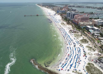 Sun seekers gather at Clearwater Beach, which remains open despite high numbers of coronavirus disease (COVID-19) infections in the state, on Independence Day in Clearwater, Florida, U.S. July 4, 2020. REUTERS/Drone Base