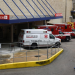 FILE PHOTO: A medical worker walks past a row of ambulances parked outside of Houston Methodist Hospital as storm clouds gather over the Texas Medical Center, amid the global outbreak of the coronavirus disease (COVID-19). in Houston, Texas, U.S., June 22, 2020. REUTERS/Callaghan O'Hare