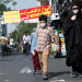 FILE PHOTO: An Iranian woman and her son wearing a protective face mask walks the street, following the outbreak of the coronavirus disease (COVID-19), in Tehran, Iran, June 28, 2020. WANA (West Asia News Agency) via REUTERS