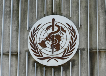 FILE PHOTO: A logo is pictured on the headquarters of the World Health Orgnaization (WHO) in Geneva, Switzerland, June 25, 2020. REUTERS/Denis Balibouse