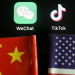 The messenger app WeChat and short-video app TikTok are seen near China and U.S. flags in this illustration picture taken August 7, 2020. REUTERS/Florence Lo/Illustration