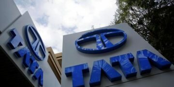 Tata Motors logos are seen at their flagship showroom in Mumbai February 14, 2013. REUTERS/Vivek Prakash/Files