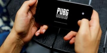 FILE PHOTO: A boy plays Tencent Holdings' PUBG videogame on his mobile phone. September 3, 2020. REUTERS/Adnan Abidi/File Photo