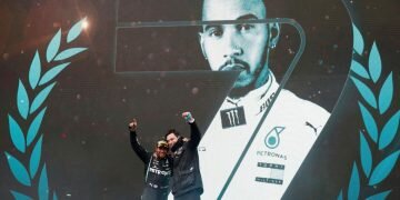 Lewis Hamilton celebrates on the podium with Mercedes team principle Toto Wolff. Photograph: Murad Sezer/Reuters