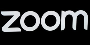 FILE PHOTO: The Zoom Video Communications logo is pictured at the NASDAQ MarketSite in New York, New York, U.S., April 18, 2019. REUTERS/Carlo Allegri/File Photo