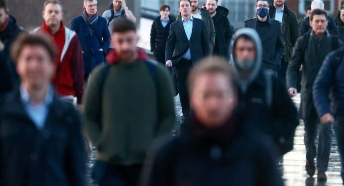 People walk across London Bridge. REUTERS/Hannah McKay/File Photo