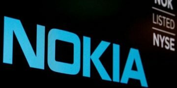 FILE PHOTO: The logo and ticker for Nokia are displayed on a screen on the floor of the New York Stock Exchange (NYSE) in New York, U.S., May 21, 2018. REUTERS/Brendan McDermid/File Photo