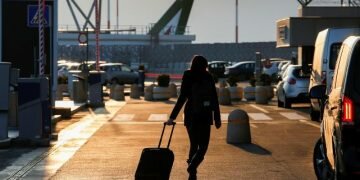 A passenger walks at the airport REUTERS/Remo Casilli