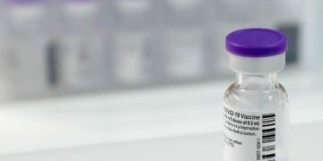 Vials of Pfizer vaccine against the coronavirus disease (COVID-19) are seen at the Messe Luzern fairground's vaccination center, as the spread of the coronavirus disease (COVID-19) continues, in Lucerne, Switzerland December 23, 2020. REUTERS/Arnd Wiegmann