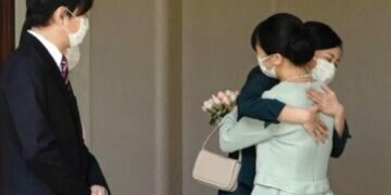 Japan's Princess Mako, hugs her sister Princess Kako, watched by her parents Crown Prince Akishino and Crown Princess Kiko, before leaving her home in Akasaka Estate in Tokyo. (Image courtesy: Associated Press)