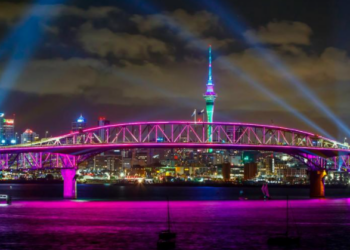 A light show from the Skytower and harbour bridge during New Year's Eve celebrations in Auckland, New Zealand.