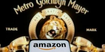 Smartphone with Amazon logo is seen in front of displayed MGM logo in this illustration (Photo: Reuters)