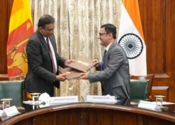 Ministers Basil Rajapaksa, S. Jaishankar and Nirmala Sitharaman witness the signing of the USD 1 billion Indo-Lanka Loan Agreement