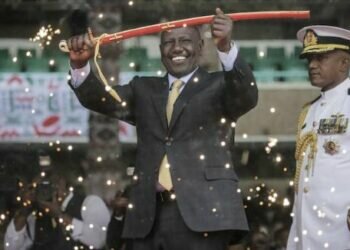 Kenya's new president William Ruto holds up a ceremonial sword as he is sworn in to office (Photo: AP)
