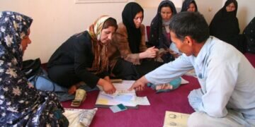 Aid groups pause work in Afghanistan after nation’s women are banned
