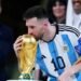 Lionel Messi kisses the World Cup trophy after receiving the Golden Ball award for best player of the tournament.