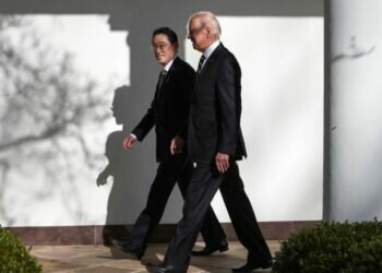 US President Joe Biden and Japanese Prime Minister Fumio Kishida walk to the Oval Office for a meeting at the White House on January 13.