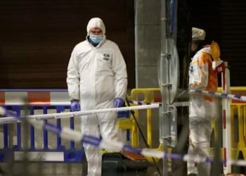 Belgian police officers search for evidence