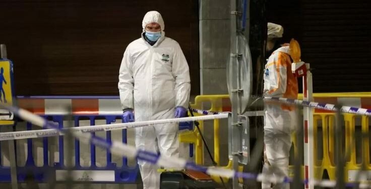 Belgian police officers search for evidence