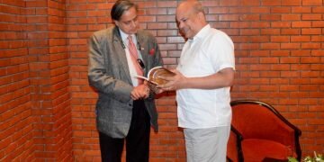 Milinda Moragoda presents a copy of Ashoka Vadana to Shashi Tharoor